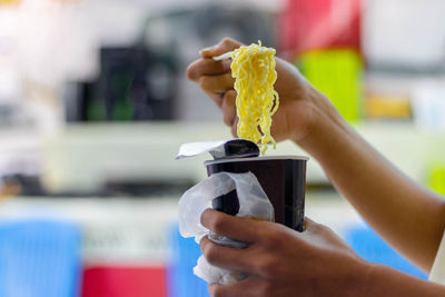 Close-up of woman hand holding ice cream