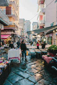 People at street market in city