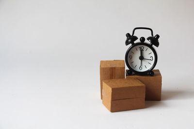 Close-up of clock against white background