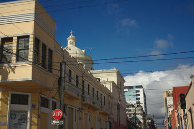 Buildings in city against sky