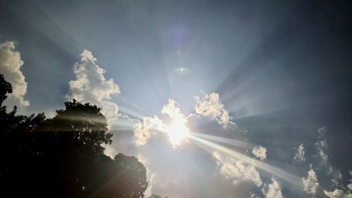 Low angle view of sun in sky