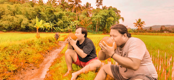 Young couple sitting in park