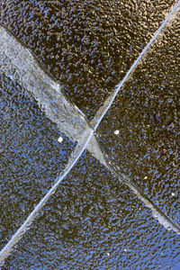 Full frame shot of water on tiled floor