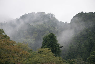 Scenic view of mountains against sky during foggy weather