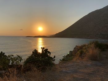 Scenic view of sea against sky during sunset