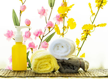 Close-up of yellow flowers in vase on table