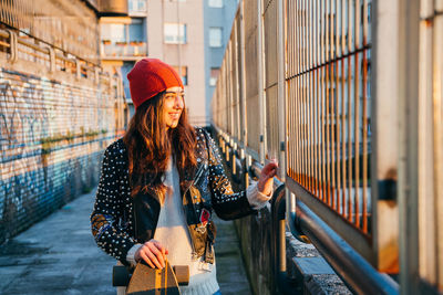 Woman looking at camera in city