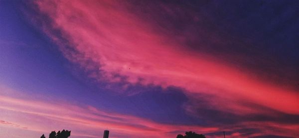 Low angle view of dramatic sky during sunset