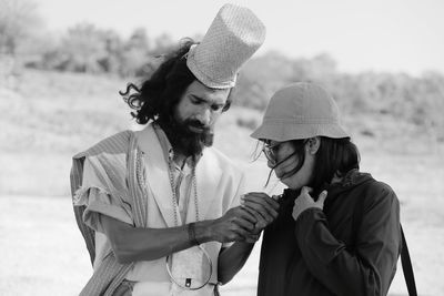 Man and woman wearing hat