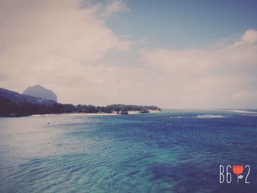 sea, water, scenics, tranquil scene, sky, tranquility, beauty in nature, horizon over water, nature, waterfront, cloud - sky, mountain, idyllic, cloud, blue, seascape, cloudy, beach, remote, non-urban scene