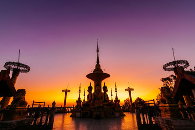 Silhouette of temple against sky during sunset