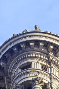 Low angle view of building against blue sky