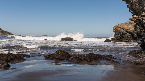 Scenic view of sea against clear sky