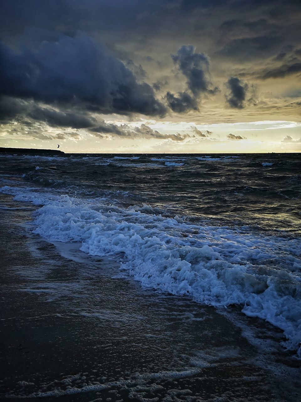 SCENIC VIEW OF BEACH DURING SUNSET