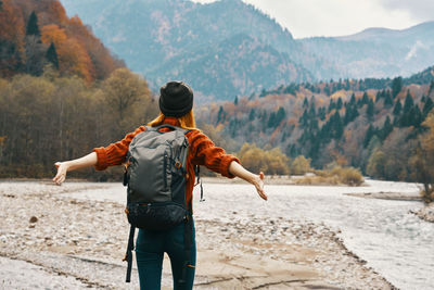 Rear view of man looking at mountains