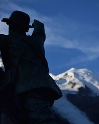 Low angle view of statue against sky