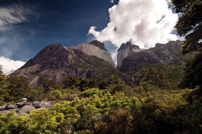 Scenic view of mountains against cloudy sky