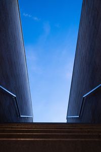 Low angle view of building against blue sky