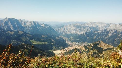 High angle view of valley and mountains against sky