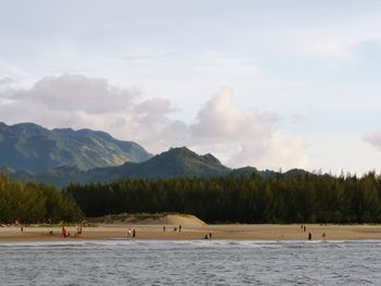 Scenic view of lake and mountains against sky