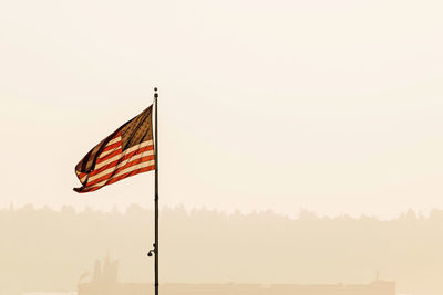 Low angle view of flag against sky