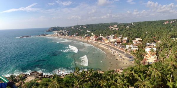 High angle view of sea and buildings against sky