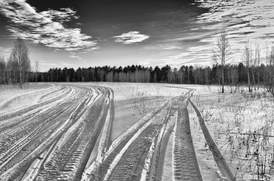 Scenic view of land against sky during winter