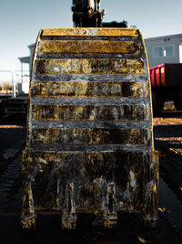 Old rusty metal structure against sky