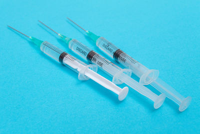 High angle view of objects on blue table