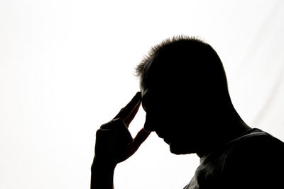 Portrait of silhouette man against white background