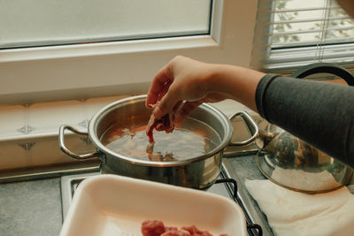 Cooking breakfast beef soup with variety of vegetables at the kitchen in the morning.