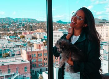 Portrait of young woman with dog