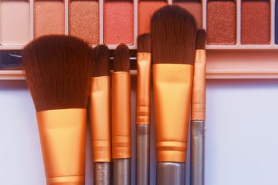 Close-up of makeup brushes on table