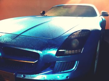 Close-up of car on road