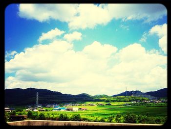 Scenic view of landscape against cloudy sky