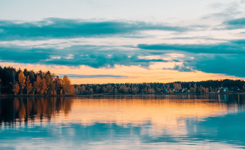 Scenic view of lake against sky during sunset