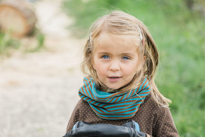 Portrait of cute girl smiling outdoors