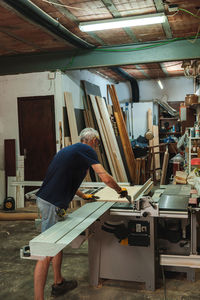 Side view of woman working