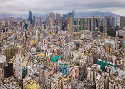 High angle view of modern buildings in city against sky