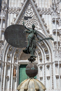 Low angle view of statue of historic building