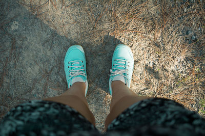 Low section of woman standing on floor