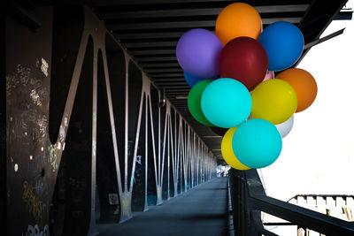 Multi colored balloons on bridge