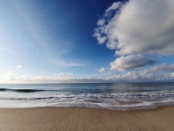 Scenic view of beach against sky