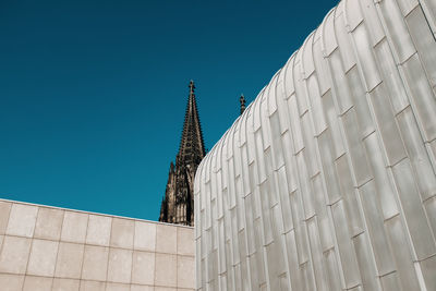 Low angle view of building against clear blue sky