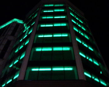 Low angle view of illuminated building at night