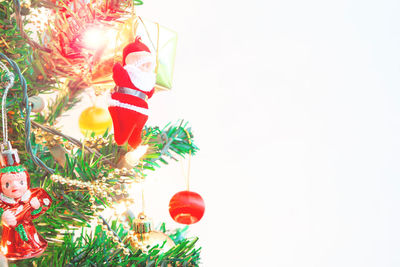 Christmas decorations hanging on tree