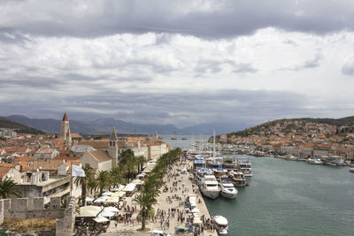 High angle view of harbor and buildings in city