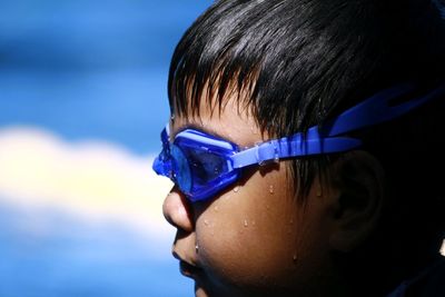 Close-up of boy wearing swimming goggles