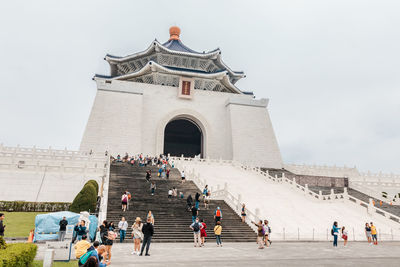 Group of people in front of historical building