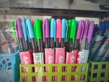Close-up of multi colored pencils in shelf